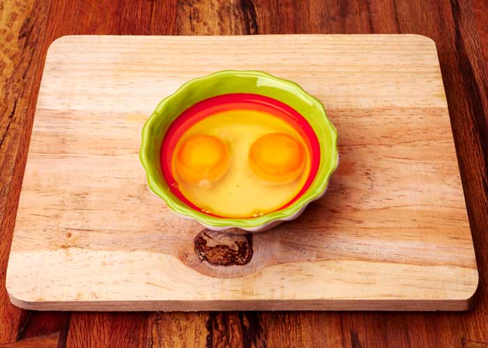 Two Craked Eggs in a Bowl