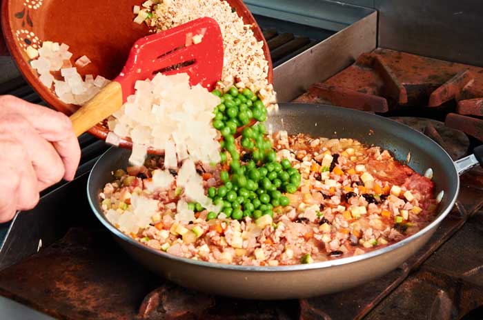 Adding Biznaga Raisins Peas