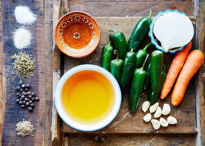 Ingredients on Cutting Board to Make Mexican Pickled Peppers (Chiles en Vinagre)