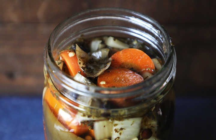 Mexican Pickled Peppers in Jar (Closeup)