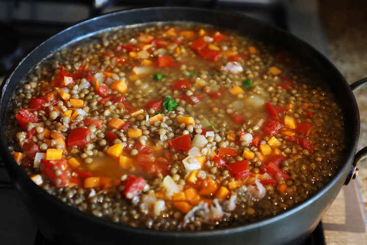 Mexican Lentil Soup Simmering on Stove